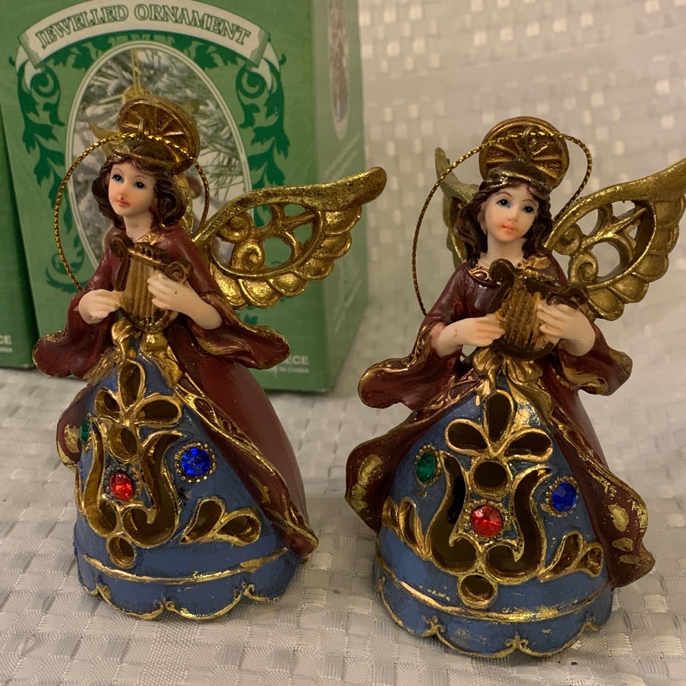 Two jewelled Angel ornaments with Blue, Red and Gold Accents. 4 inches tall.